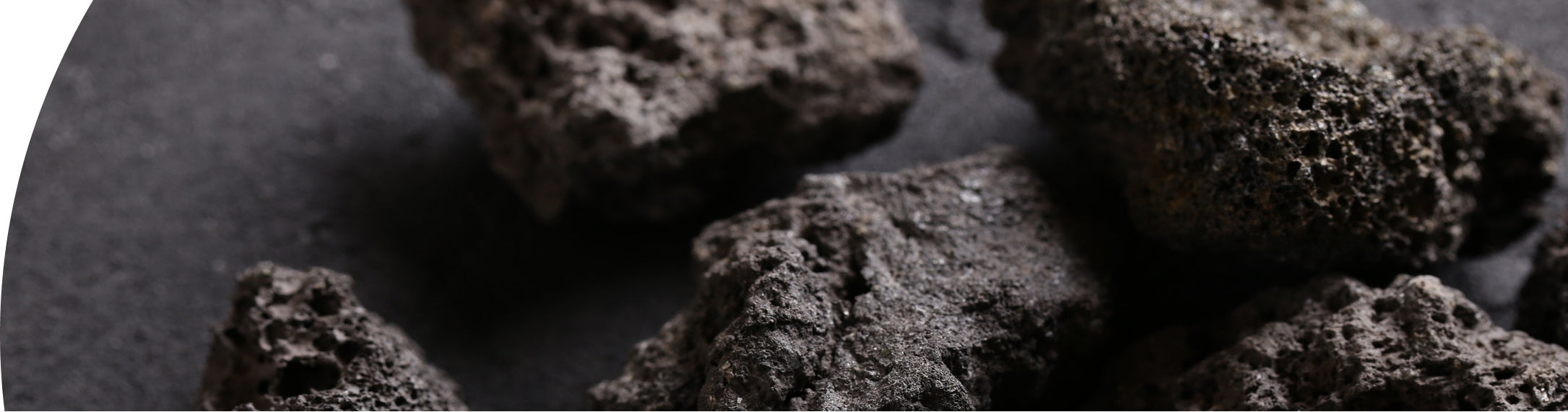 Close-up of dark rocks on a black background