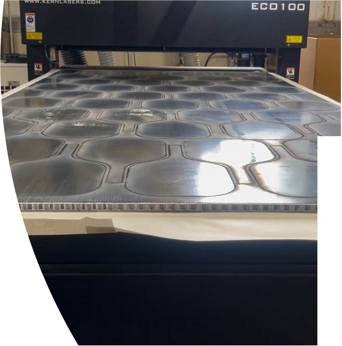 Machine cutting out Revolin pickleball paddles